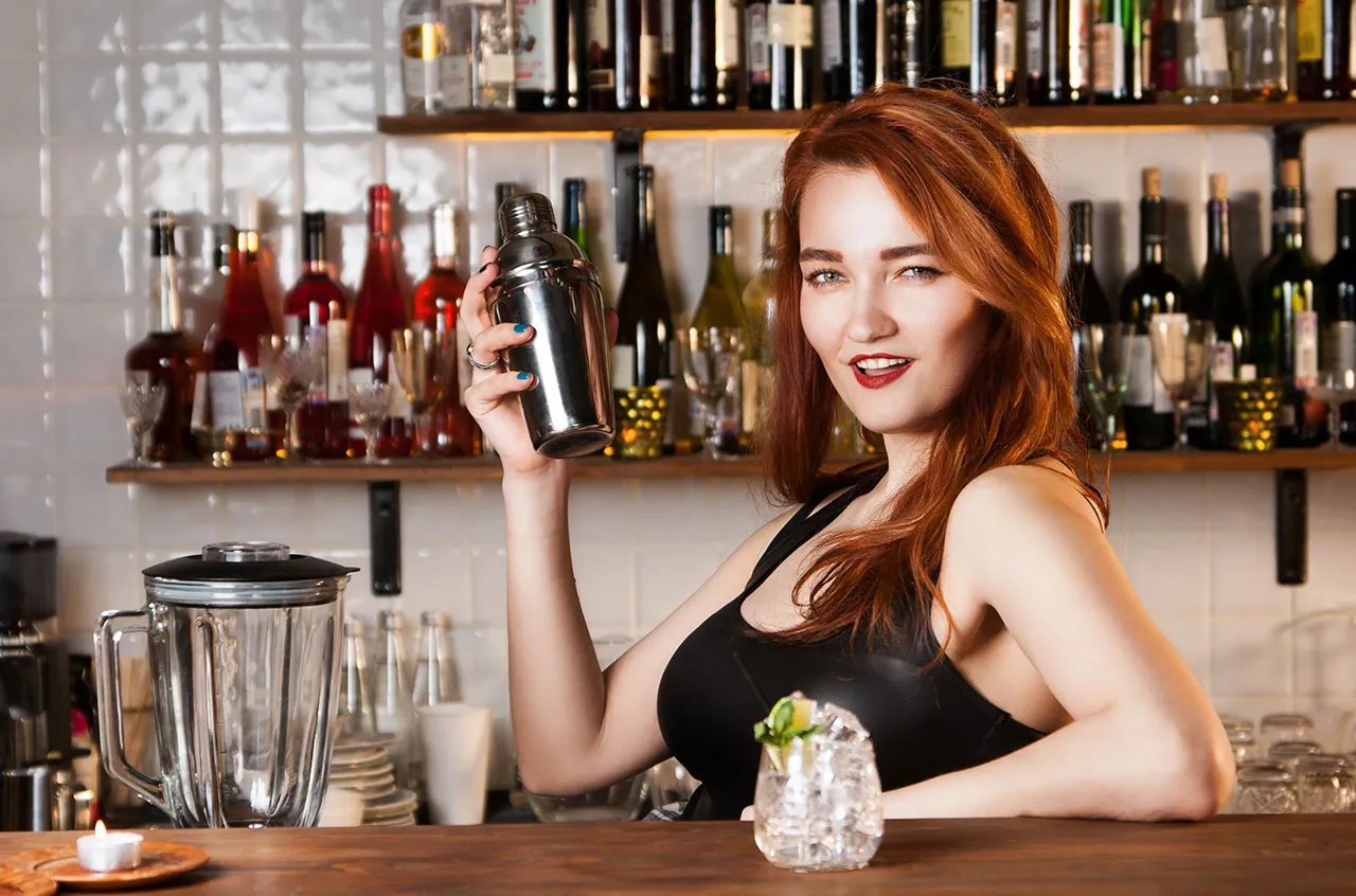 Female bartender with shaker