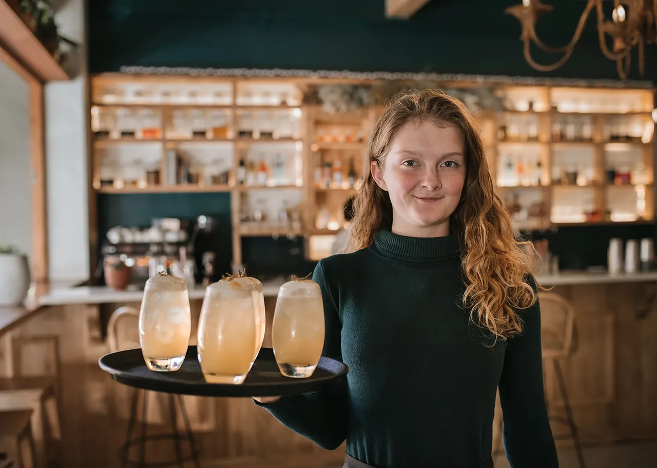 Female server with drink tray